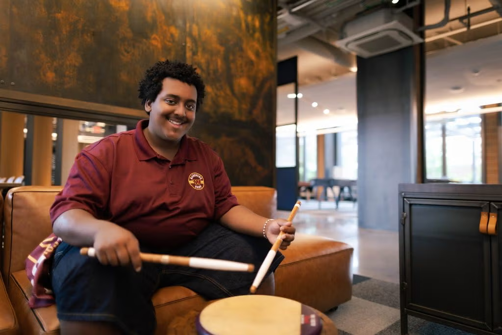 Emmanuel Assefa drumming on portable snare
