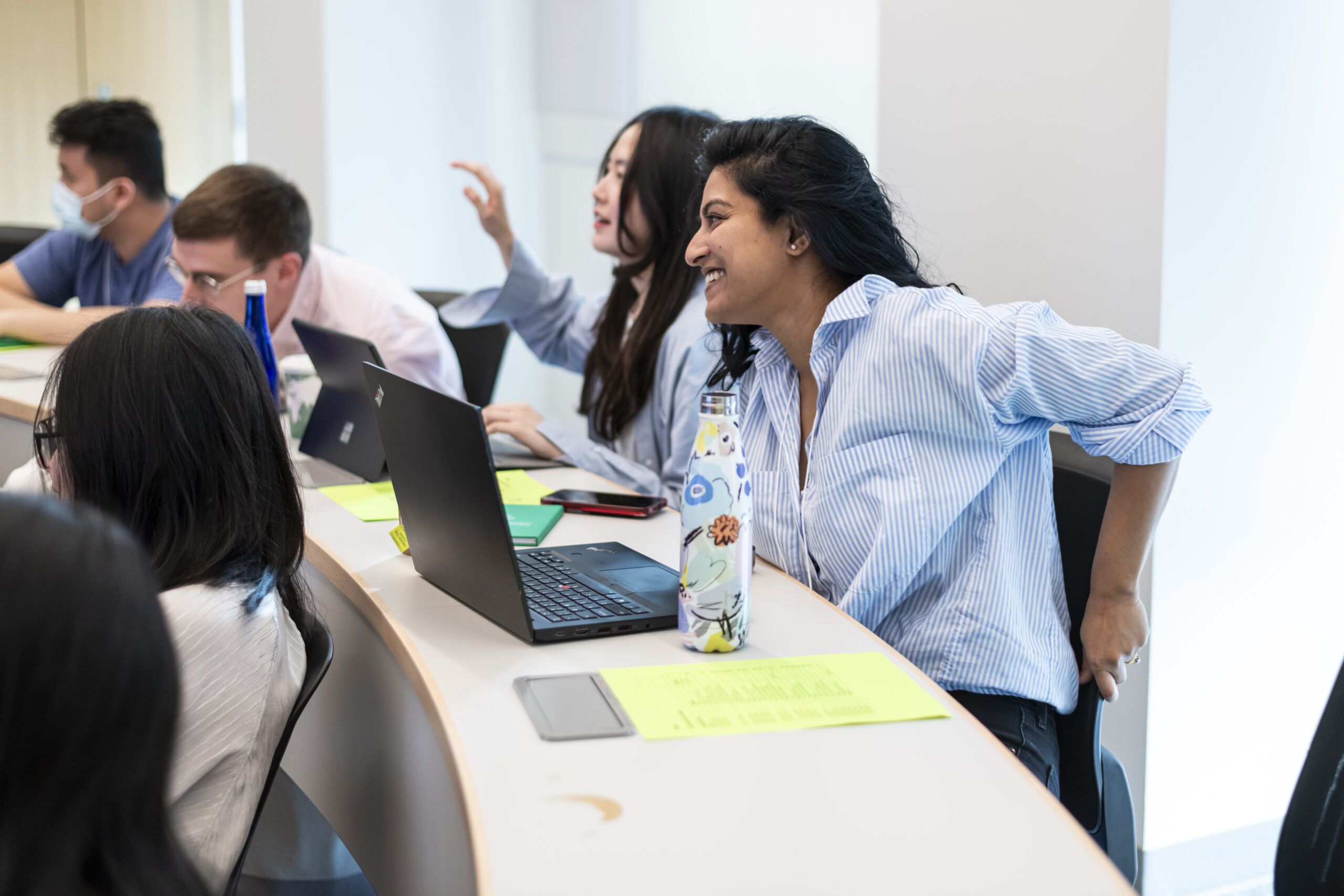 Young woman laughing and smiling in classroom