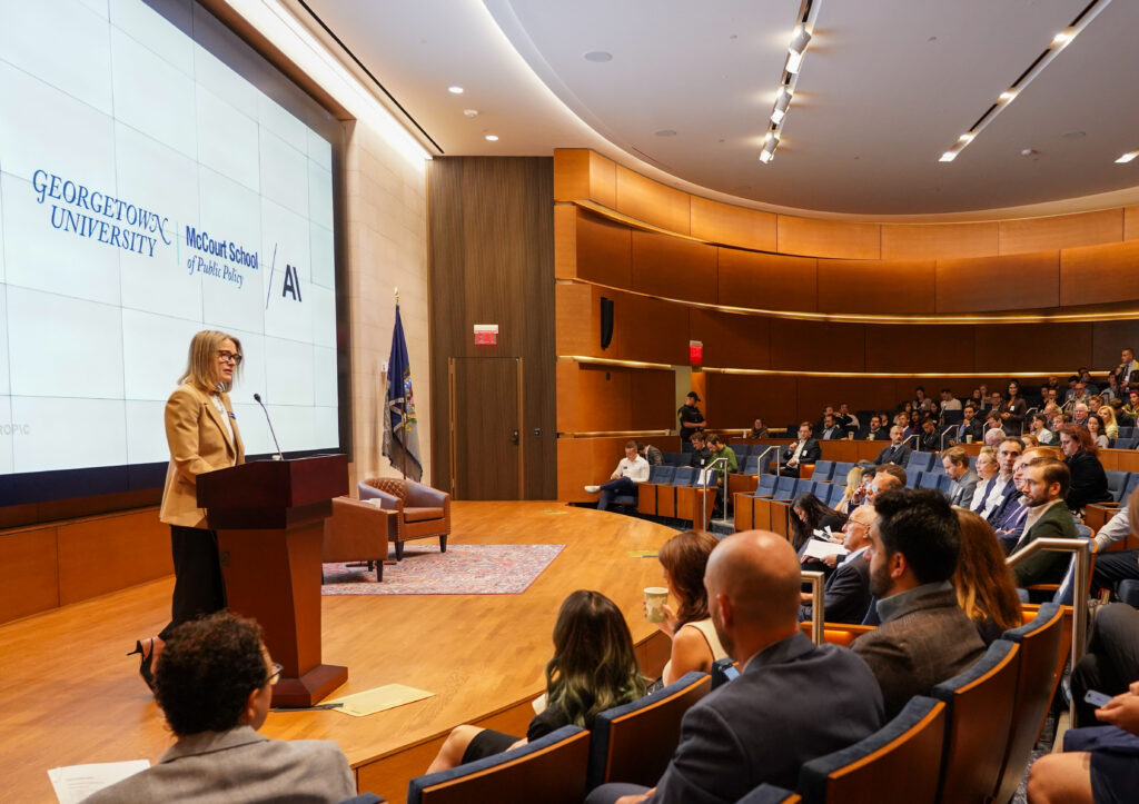 Dean Carole Roaz Gresenz gives opening remarks at the symposium