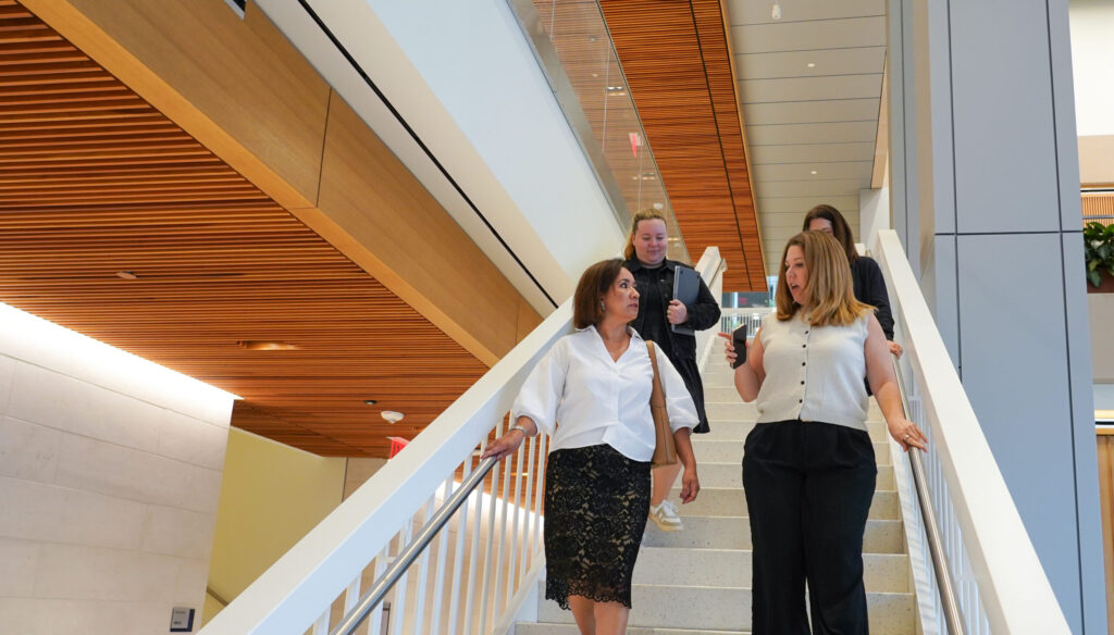 EMPL students walking down staircase