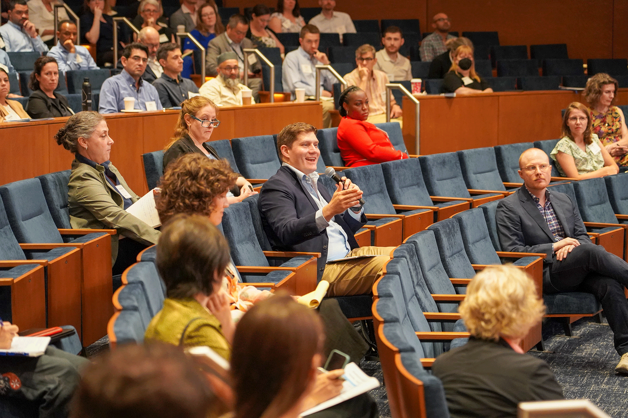 Audience member asks question during event