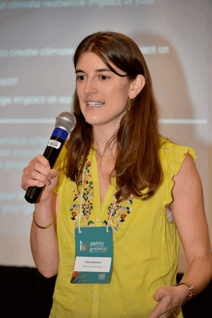 Lillian Alexander (MIDP’20), director of impact at Mercy Corps Ventures, speaking at an impact investing conference.