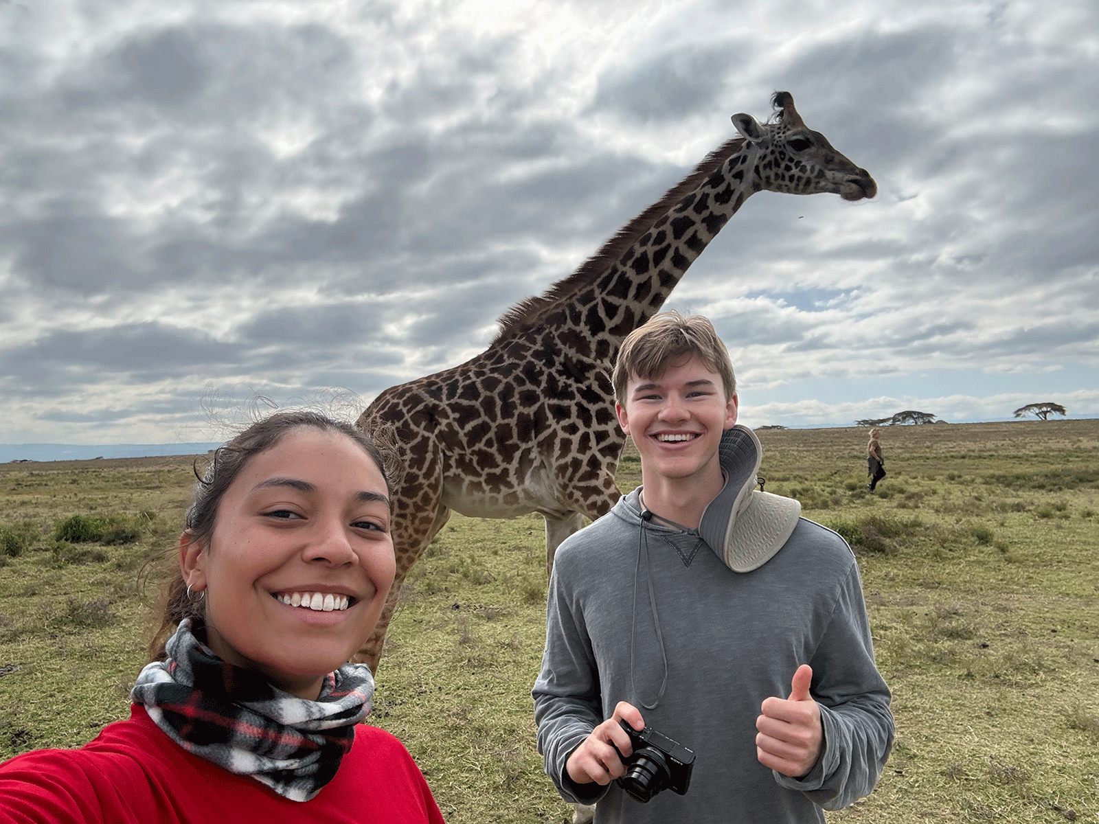 Sugden and friend in front of giraffe