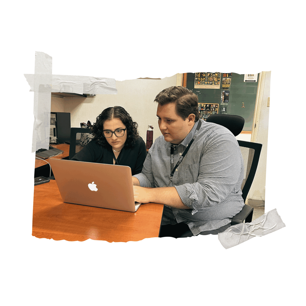 Alec Brockell and Constanza Alarcon building experimental trial on laptop